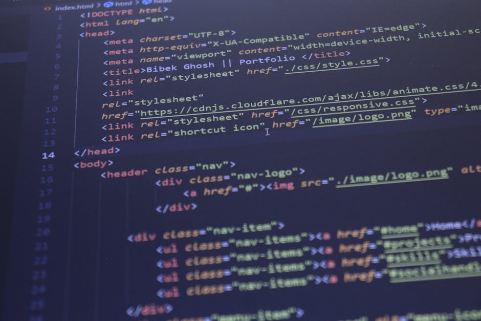 Digital coding screen displaying lines of HTML and CSS code with multicoloured text on a dark background, indicative of web development. The code is partially blurred but clearly shows tags, attribute